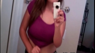Busty legal age teenager sweetheart shows her large milk sacks during the time that taking selfie