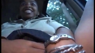 Thick dark bitch with a large butt plays with her twat in car